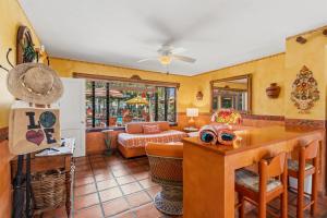 a living room with a table and a couch at Blue Seas Courtyard in Fort Lauderdale