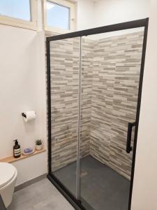 a shower with a glass door in a bathroom at Seaview.Cassis in Cassis +10 photos