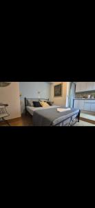 a bedroom with a bed and a table at Hera's Hideaway in Samos