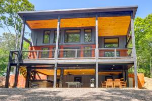 a house on a hill with a large deck at Blue Ridge, McCaysville, Rafting, Tubing, Secluded in Copperhill