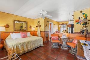 a bedroom with a bed and a table and chairs at Blue Seas Courtyard in Fort Lauderdale +82 photos