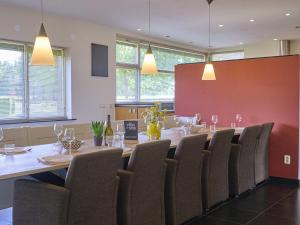 a conference room with a long table and chairs at Laurahoeve in Nederweert