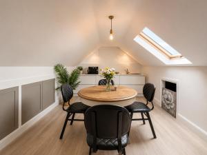 a kitchen and dining room with a table and chairs at Charlettes Lodge in Cobh