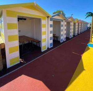 a row of beach huts at a resort at The Casa Descanso in Rhyl
