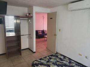 a room with a living room with a couch at Casa completa con 3 habitaciones in Monterrey +23 photos