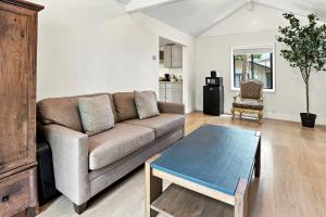 a living room with a couch and a table at Carmel Resort Inn in Carmel