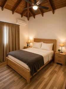 a bedroom with a bed and a ceiling fan at Paraiso Destiny E2 in Bayahibe