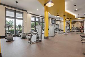 a gym with rows of treadmills and machines at Walk to Toyota Stadium in Frisco