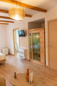 a living room with a table in a room at Chiarelli Mountain Suite in Camigliatello Silano