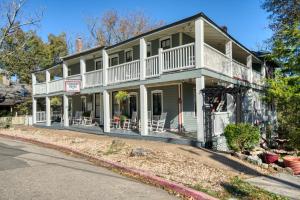 a large house with a wrap around porch at Downtown Four Poster Piedmont in Eureka Springs