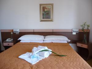 Postel nebo postele na pokoji v ubytování Hotel Suprem sul Mare