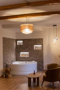 a large bathroom with a tub in a room at Chiarelli Mountain Suite in Camigliatello Silano