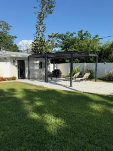 a pavilion in a yard with a lawn at Sophisticated Charm in St Pete in St. Petersburg