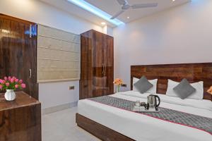 a bedroom with a bed and a sink in it at Townhouse Hotel Spotlight in Nawābganj +31 photos