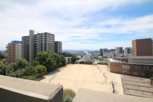 an empty parking lot in the middle of a city at オンブラージュ704号室-無料駐車場付き-繁華街まで徒歩圏内-南向きで明るいワンルーム in Kumamoto