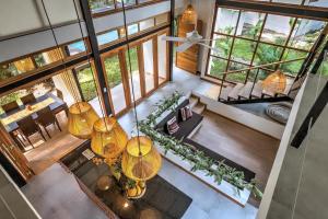an overhead view of a living room with large windows at Porto Alegre Villas in Punta Uva