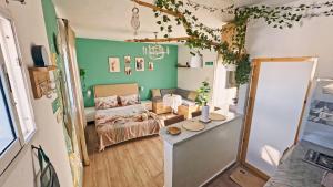 a living room with a couch and a table at Rooftop Treehouse - Hammam Sousse in Sousse