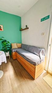 a bed in the corner of a room at Rooftop Treehouse - Hammam Sousse in Sousse