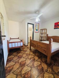 a room with two beds in a room at Pousada N'ativaMar in Guaratuba +36 photos
