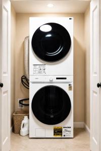 a microwave oven with two plates on top of it at Journal Sq PATH - Private Queen Room - Private Bath - Shared Kitchen - 15 Min to NYC in Jersey City