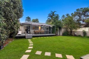 a house with a large yard with a patio at Stockton Coastal Escape in Stockton