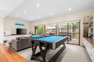 a living room with a pool table in it at 9 Doors From Front Beach in Point Lonsdale