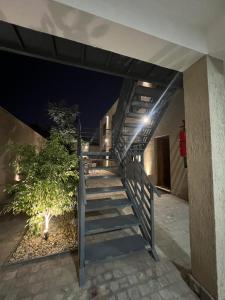 a staircase leading up to a house at night at Base de los Andes 4 in Maipú