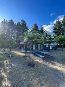 a group of benches in a park with trees at Campo Yumbel in Yumbel