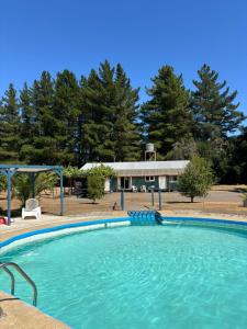a large swimming pool in front of a house at Campo Yumbel in Yumbel