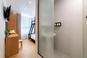 a bathroom with a walk in shower next to a bedroom at Stay5 Jongno in Seoul