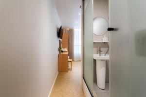 a bathroom with a sink and a mirror at Stay5 Jongno in Seoul +78 photos