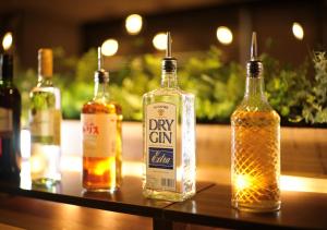 a group of bottles of alcohol sitting on a table at Super Hotel Yokkaichi Route 1 in Yokkaichi