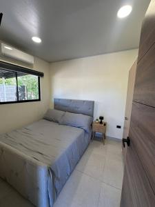 a bedroom with a bed and a window at Temptika Villa 2, New Property in Tempate