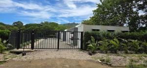 a black metal gate in front of a building at Temptika Villa 1, New Property in Tempate