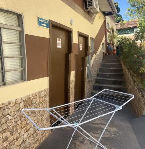 a shopping cart sitting outside of a building at Pousada Dubai in Cuiabá +11 photos