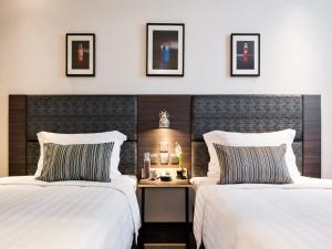 Voodi või voodid majutusasutuse Camlux Hotel toas