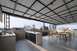 a kitchen and dining room with a view of the city at Cove Atman in Jakarta