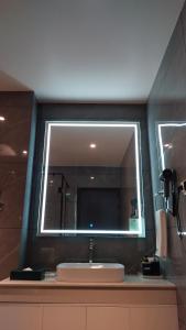 a bathroom with a sink and a mirror at Tshang RI in Thimphu