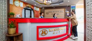 a group of people standing at a bar at Rameshworam Hotel in Kathmandu