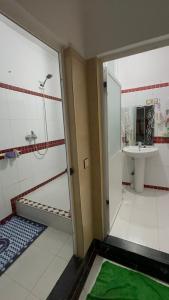 a bathroom with a shower and a sink at Martil in Martil
