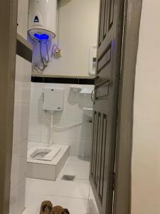 a small bathroom with a toilet and a sink at Mariner Lodge Skardu in Skardu +158 photos