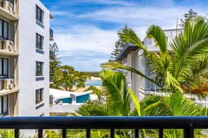 a view of the ocean from the balcony of a building at Belaire Place Motel Apartments in Caloundra