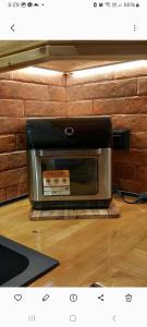 a toaster oven sitting on top of a wooden floor at Villa Mareta in Svoronata