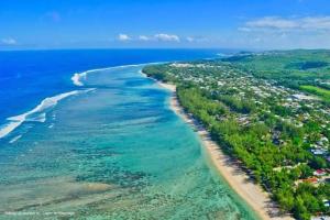 an aerial view of a beach and the ocean at L' Aurore de Cassandre in Saint-Paul