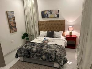 a bedroom with a bed with a blanket on it at Serenity Haven in Chongwe