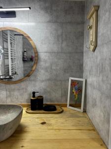 a bathroom with a sink and a mirror at Hostel Nomad in Tbilisi City