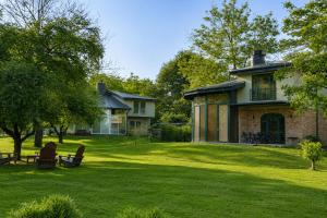 a house with a grass yard with a building at Villa Kirkpinar Sapanca in Sapanca
