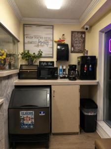 a coffee shop with a counter with a coffee machine at The Boards AC in Atlantic City