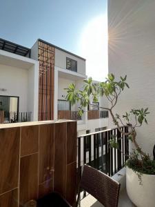 a balcony of a house with a wooden railing at 喜滿家民宿 in Zhuqi