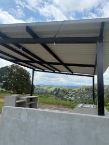awning on top of a building with a view at Masinga FarmHouse in Filandia